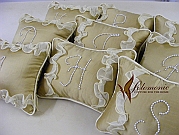 Pillows with welt, ruffles and pearl monogram. Wonderful gift for clients or friends